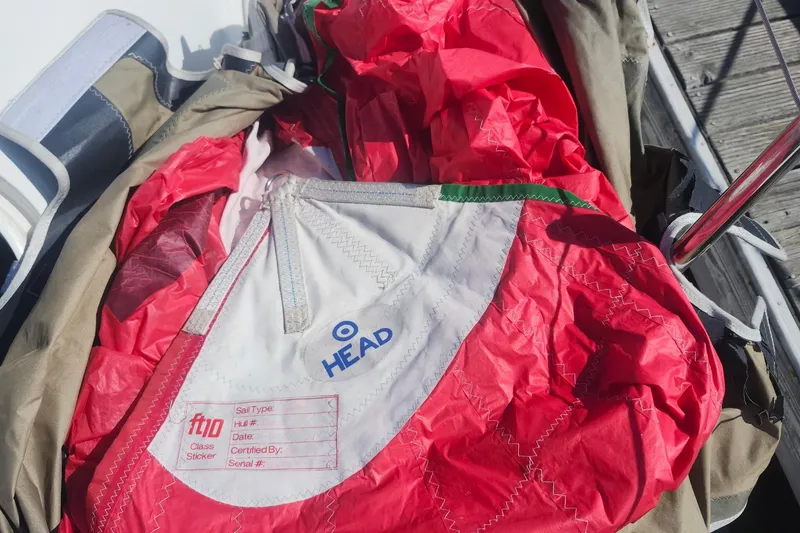 Slide: The Image of Red and white sail with "HEAD" logo, Flying Tiger FT-10M, 2007 model. - 50