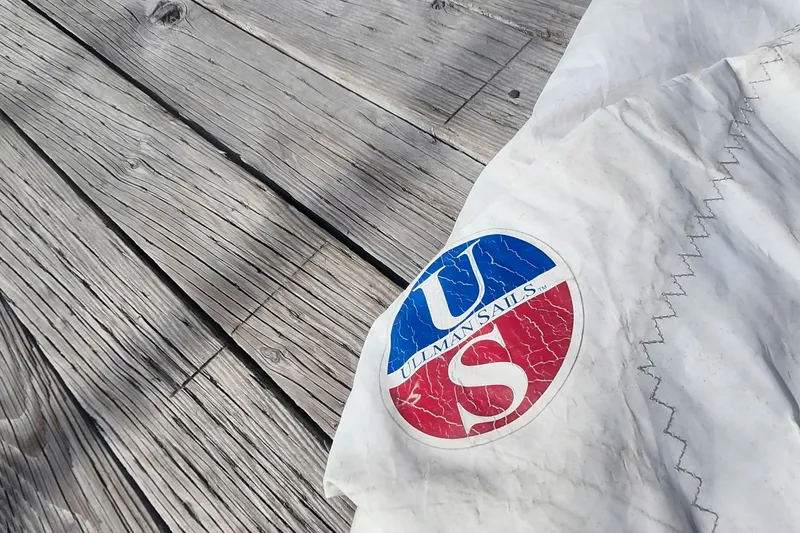 Slide: The Image of Sail with Ullman Sails logo on wooden deck, Flying Tiger FT-10M, 2007. - 51