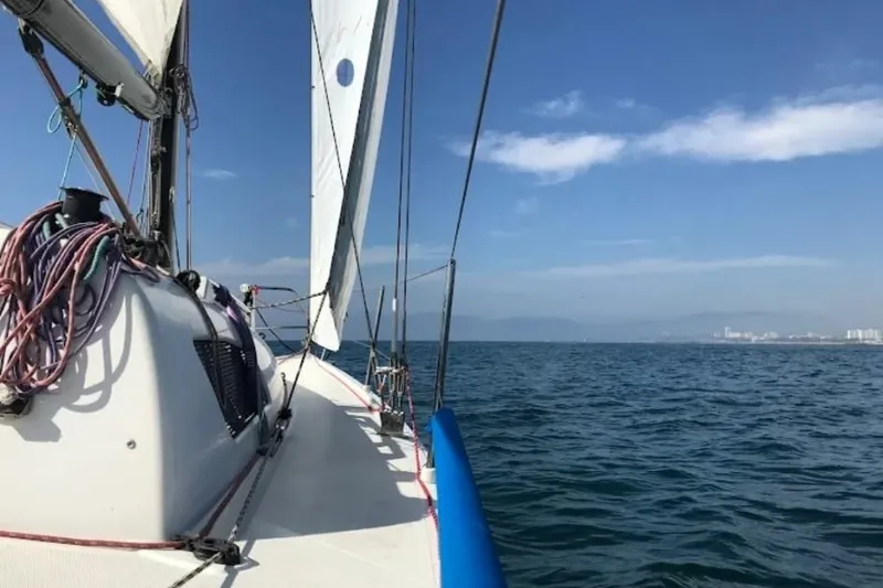 Slide: The Image of Sailing on a Flying Tiger FT-10M yacht, 2007 model, under clear blue skies. - 54