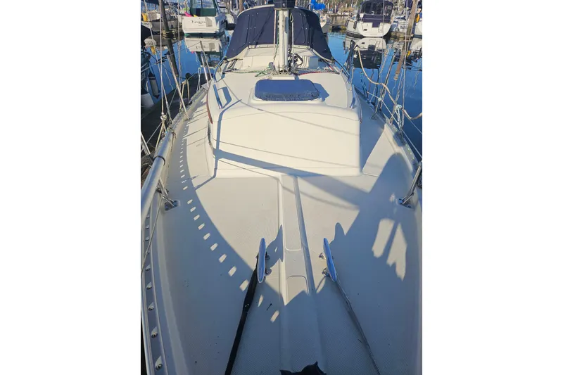 Slide: The Image of Pacific Seacraft Dana 24 sailboat deck, 2003 model, docked in a marina. - 10