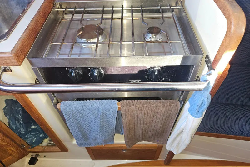 Slide: The Image of Stainless steel stove in 2003 Pacific Seacraft Dana 24 sailboat galley. - 15