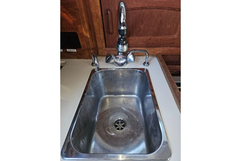 Slide: The Image of Stainless steel sink in 2003 Pacific Seacraft Dana 24 yacht galley. - 16