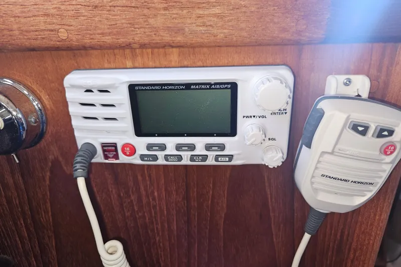 Slide: The Image of Standard Horizon radio on 2003 Pacific Seacraft Dana 24 sailboat, featuring AIS/GPS functionality. - 25