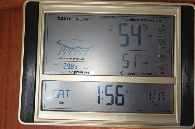 Slide: The Image of Digital weather display on Pacific Seacraft Dana 24, showing temperature and barometric pressure. - 28