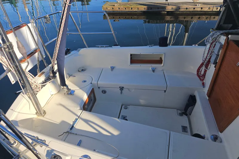 Slide: The Image of 2003 Pacific Seacraft Dana 24 sailboat cockpit with seating and storage compartments. - 4