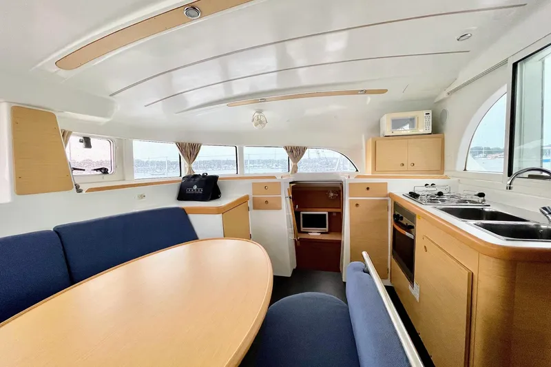 Slide: The Image of Interior of 2008 Lagoon 380 S2 catamaran with kitchen and dining area. - 11