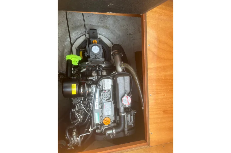 Slide: The Image of Engine compartment of a 2008 Lagoon 380 S2 catamaran, showcasing mechanical components. - 28