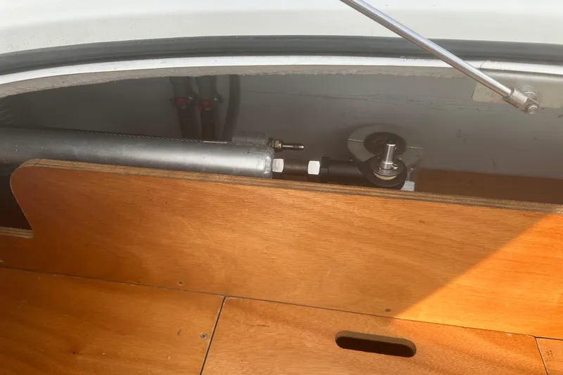 Slide: The Image of Wooden compartment in a 2008 Lagoon 380 S2 yacht, showing mechanical components. - 30