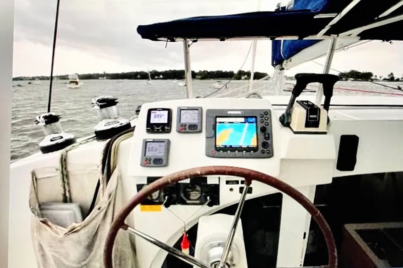Slide: The Image of Cockpit view of 2008 Lagoon 380 S2 catamaran with navigation instruments and steering wheel. - 8