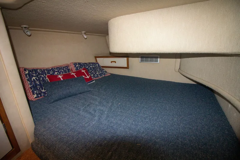 Slide: The Image of Interior of 1993 Sea Ray 440 Express Bridge with cozy bed. - 44
