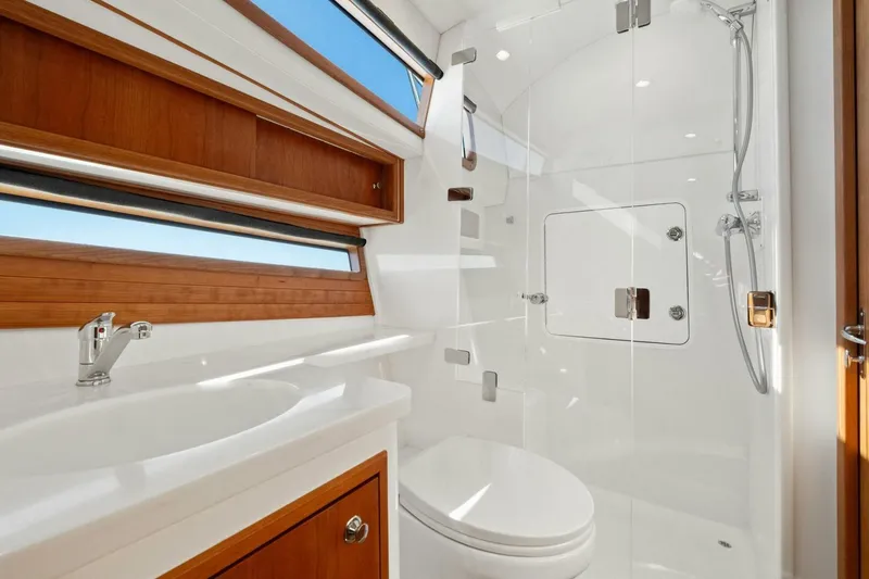 Slide: The Image of Luxurious bathroom in 2026 MJM 47R yacht with modern fixtures and wooden accents. - 14