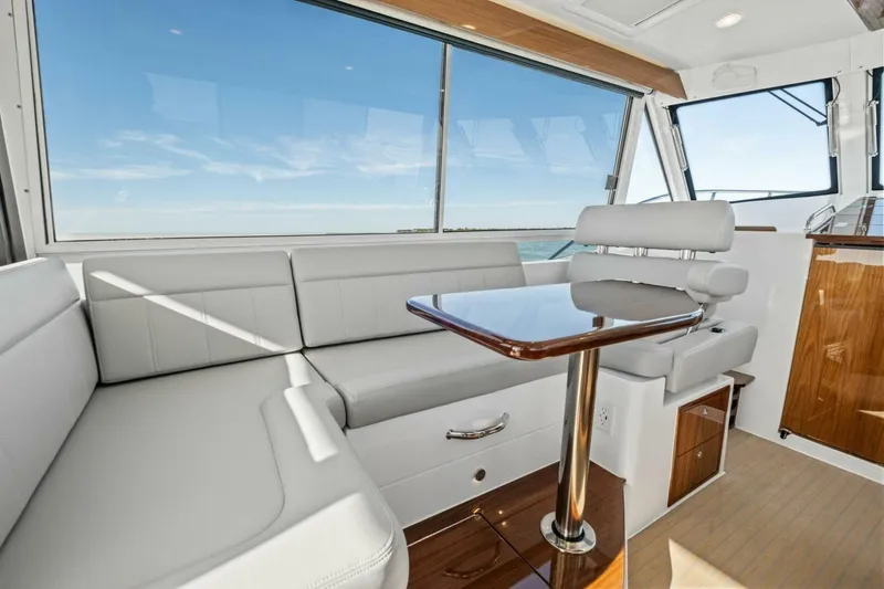Slide: The Image of Luxurious interior of 2026 MJM 47R yacht with sleek seating and ocean view. - 24