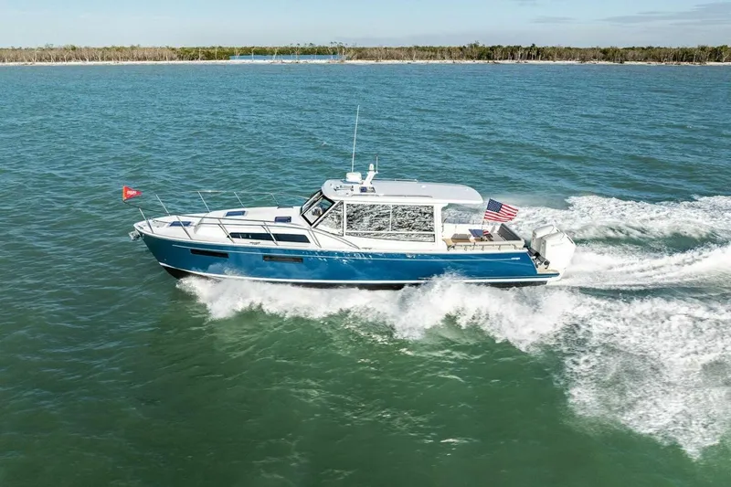 Slide: The Image of 2026 MJM 47R yacht cruising on open water, displaying sleek design and performance. - 50