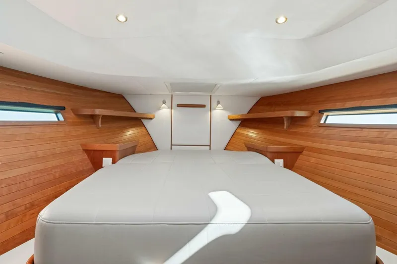 Slide: The Image of Luxurious cabin interior of 2026 MJM 47R yacht with wooden accents and modern lighting. - 9