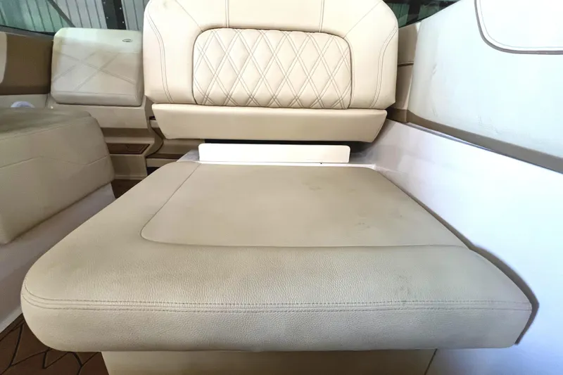 Slide: The Image of Beige leather seating in 2021 Regal 26 XO boat interior. - 24