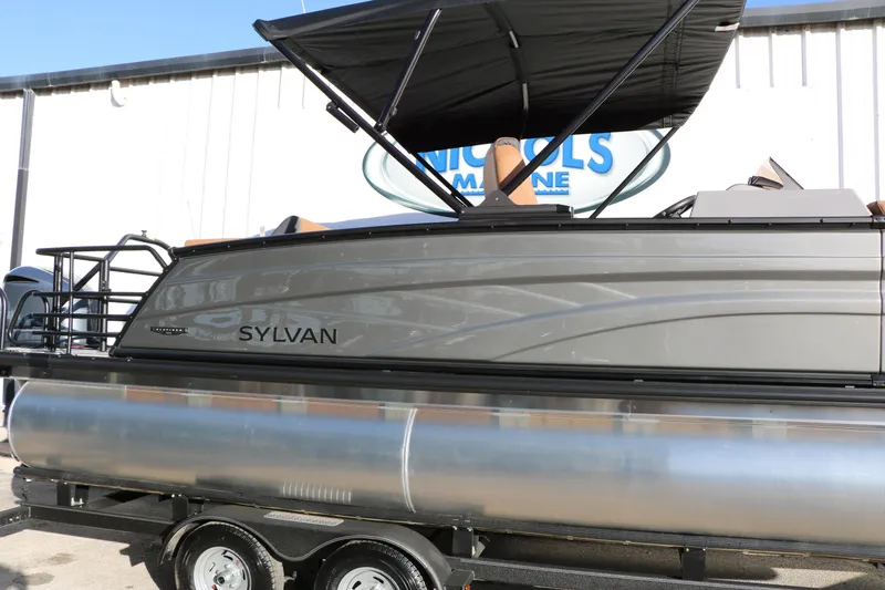 Slide: The Image of 2026 Sylvan L3 LZ DH Platinum Edition Tri-Toon boat with canopy on trailer. - 12