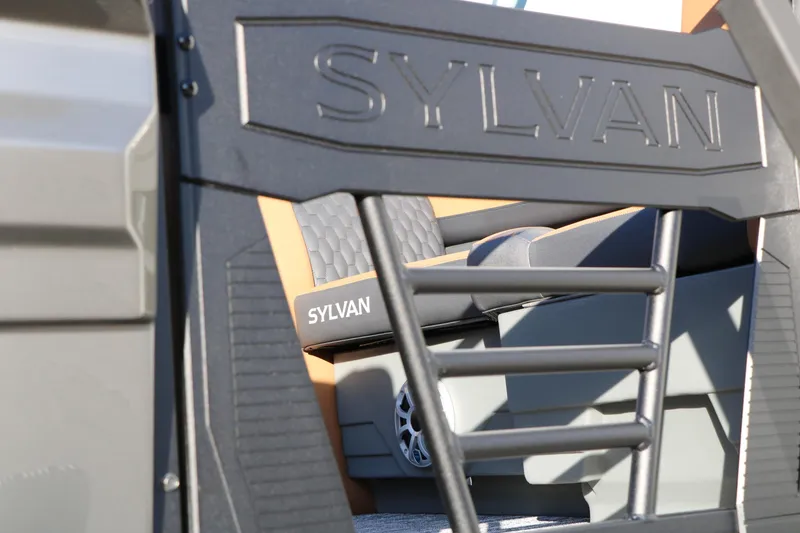 Slide: The Image of 2026 Sylvan L3 LZ DH Platinum Edition Tri-Toon interior detail with branded seating. - 16