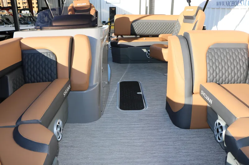 Slide: The Image of 2026 Sylvan L3 LZ DH Platinum Edition Tri-Toon interior with luxurious seating and modern design. - 22