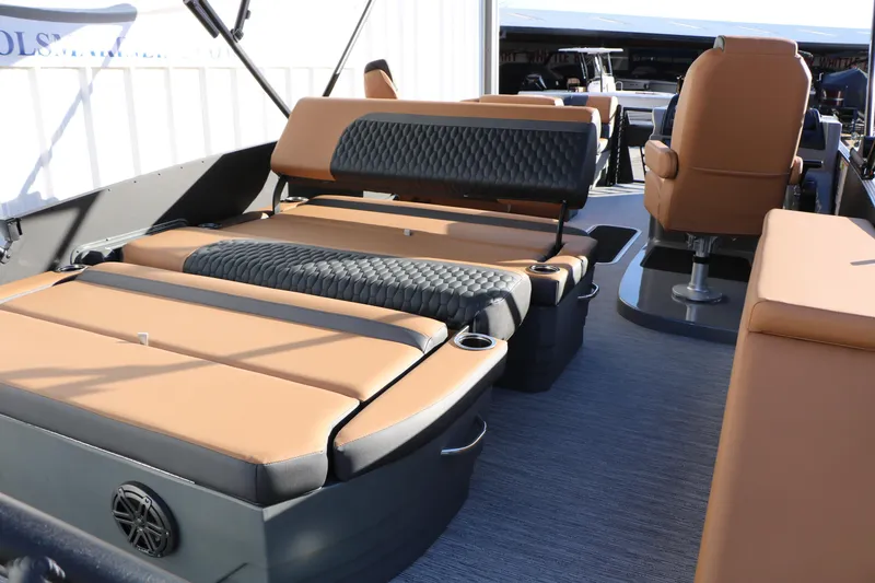 Slide: The Image of 2026 Sylvan L3 LZ DH Platinum Edition Tri-Toon interior with luxurious seating and cup holders. - 32