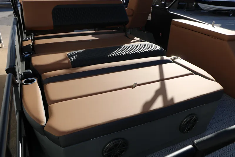 Slide: The Image of 2026 Sylvan L3 LZ DH Platinum Edition Tri-Toon interior with luxurious seating and cup holders. - 33