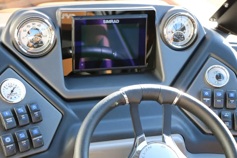 Slide: The Image of 2026 Sylvan L3 LZ DH Platinum Edition Tri-Toon dashboard with Simrad display and controls. - 43