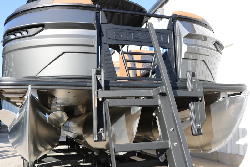 Slide: The Image of 2026 Sylvan L3 LZ DH Platinum Edition Tri-Toon boat, close-up view from below. - 5