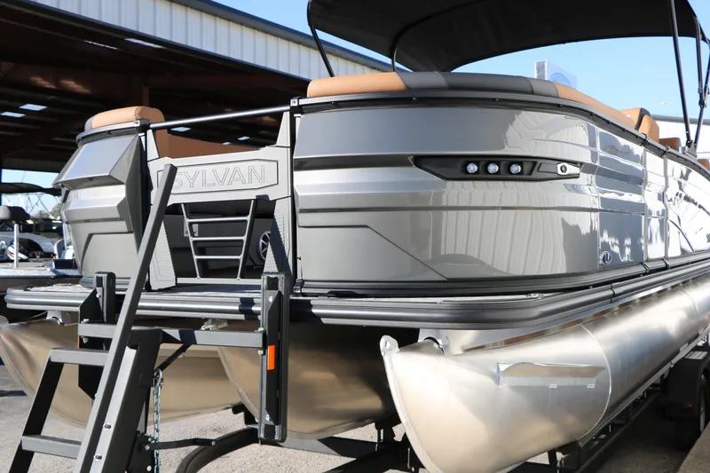 Slide: The Image of 2026 Sylvan L3 LZ DH Platinum Edition Tri-Toon boat with sleek design and modern features. - 6