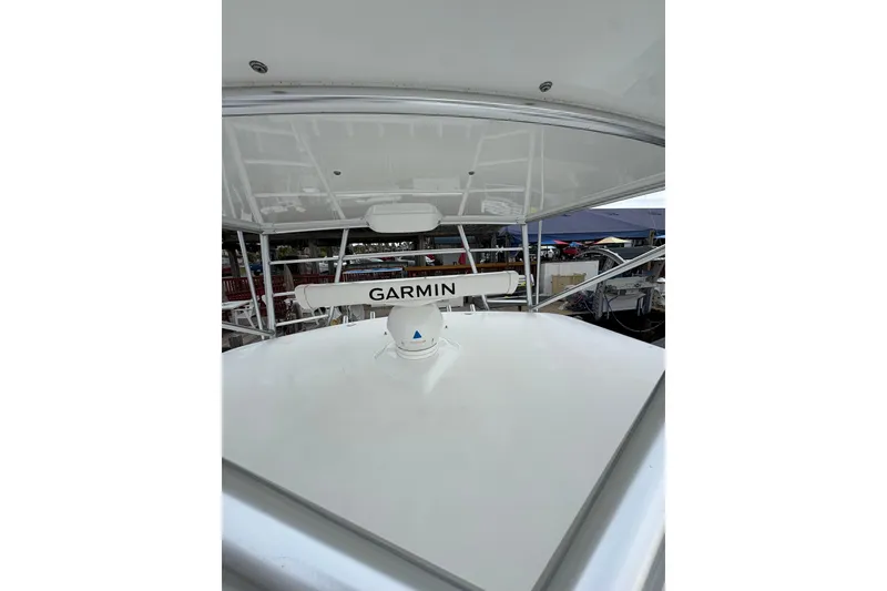 Slide: The Image of 2004 Cabo 40 Hardtop Express boat with Garmin radar system on deck. - 15