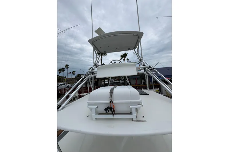 Slide: The Image of 2004 Cabo 40 Hardtop Express boat with tower and equipment on deck. - 16