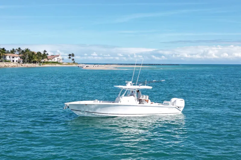 The Image of 2025 Jupiter 32 FS boat on blue ocean near tropical coastline. - 0