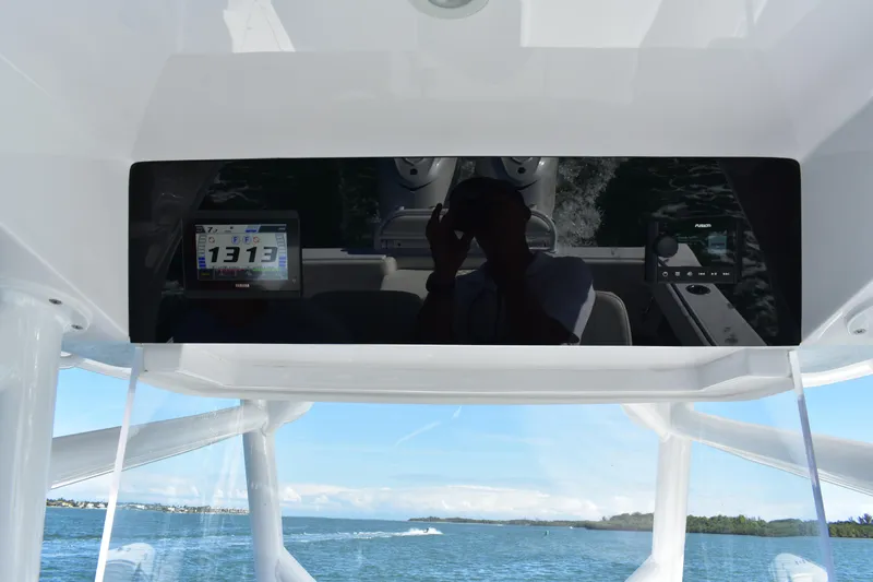 Slide: The Image of 2025 Jupiter 32 FS boat dashboard with digital displays on a sunny day. - 10