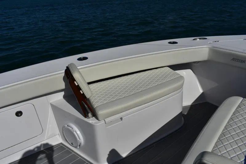 Slide: The Image of Luxury seating on 2025 Jupiter 32 FS boat, featuring diamond-stitched upholstery. - 11