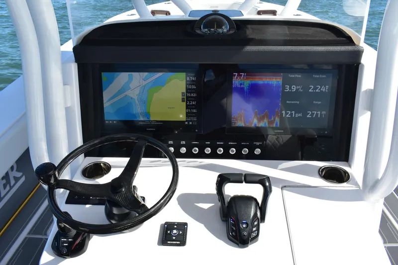 Slide: The Image of Helm of 2025 Jupiter 32 FS boat with advanced navigation displays and controls. - 3