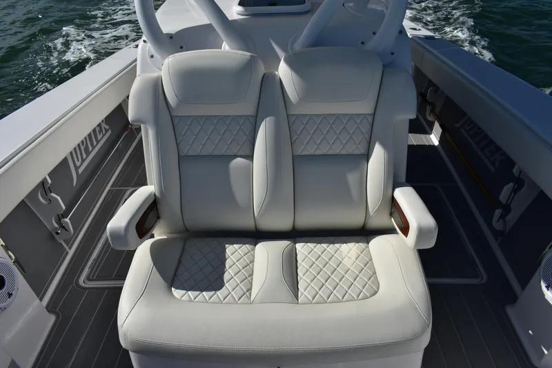 Slide: The Image of Luxurious seating on 2025 Jupiter 32 FS boat with quilted upholstery. - 6