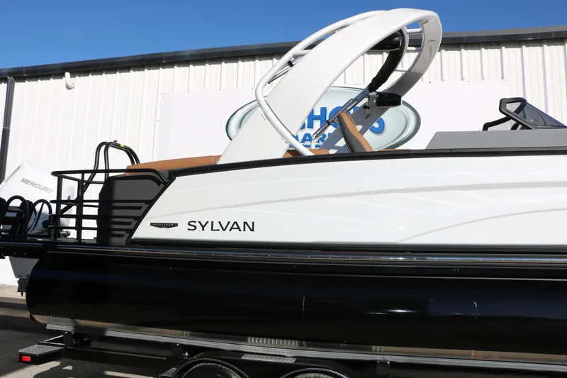 Slide: The Image of 2026 Sylvan G5 LZ DH Platinum Edition Tri-Toon boat, side view, outdoors. - 14