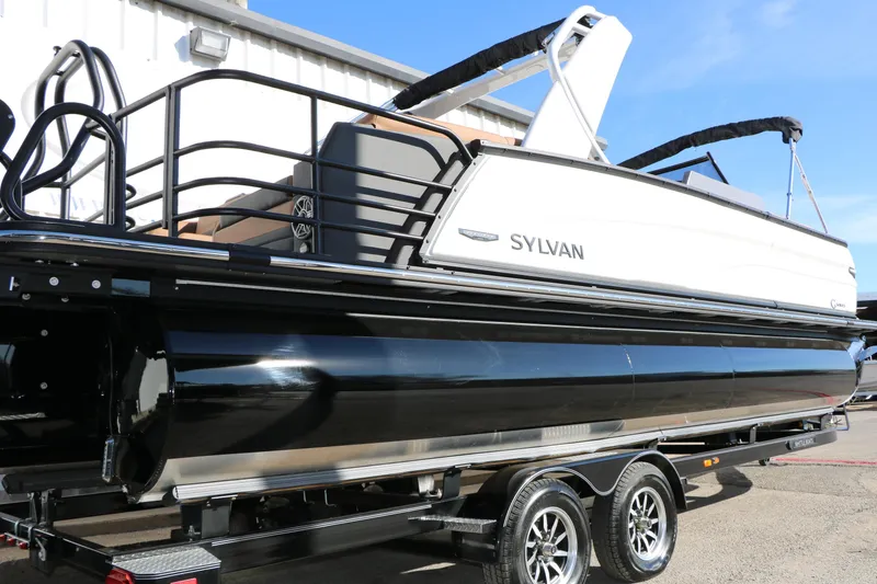 Slide: The Image of 2026 Sylvan G5 LZ DH Platinum Edition Tri-Toon boat on trailer, side view. - 18