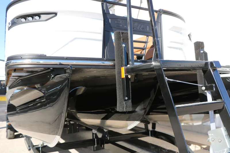 Slide: The Image of 2026 Sylvan G5 LZ DH Platinum Edition Tri-Toon boat, close-up of hull and ladder. - 20
