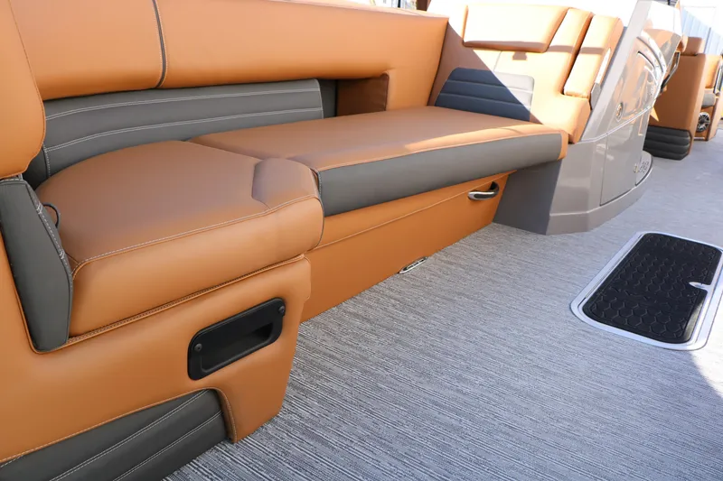 Slide: The Image of Luxurious seating on 2026 Sylvan G5 LZ DH Platinum Edition Tri-Toon boat interior. - 22