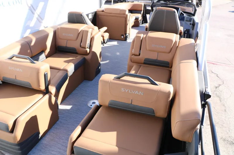 Slide: The Image of 2026 Sylvan G5 LZ DH Platinum Edition Tri-Toon with luxurious tan seating. - 26