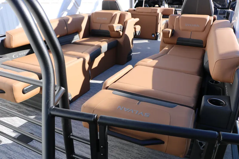 Slide: The Image of Luxurious interior of 2026 Sylvan G5 LZ DH Platinum Edition Tri-Toon with tan leather seating. - 29