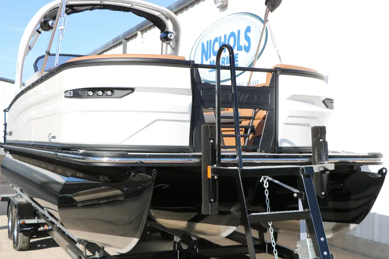 Slide: The Image of 2026 Sylvan G5 LZ DH Platinum Edition Tri-Toon boat on trailer, rear view. - 3