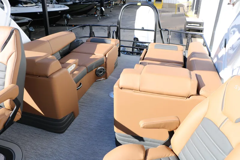 Slide: The Image of Luxurious interior of 2026 Sylvan G5 LZ DH Platinum Edition Tri-Toon with tan leather seating. - 37
