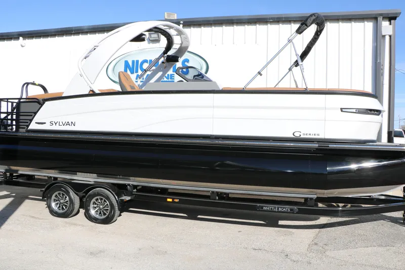 Slide: The Image of 2026 Sylvan G5 LZ DH Platinum Edition Tri-Toon boat on trailer, side view. - 6