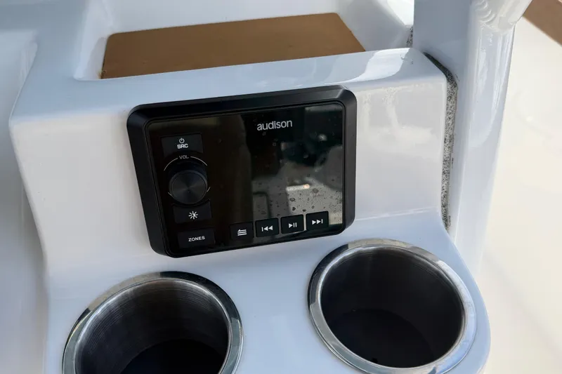 Slide: The Image of Control panel and cup holders on 2023 Sea Pro 239 Deep V CC boat. - 10