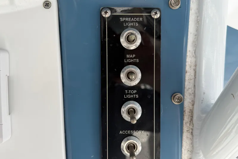 Slide: The Image of Control panel of 2023 Sea Pro 239 Deep V CC boat with light switches. - 13