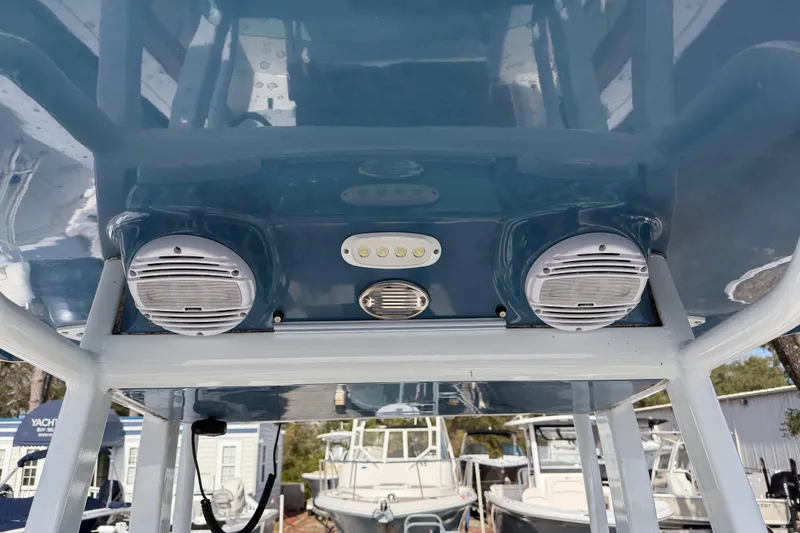 Slide: The Image of 2023 Sea Pro 239 Deep V CC boat speakers and lights on blue canopy. - 14