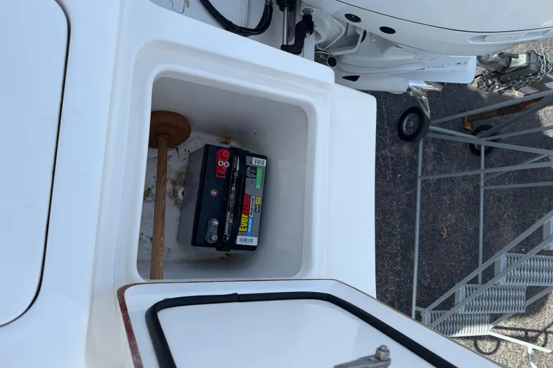 Slide: The Image of Battery compartment of 2023 Sea Pro 239 Deep V CC boat, featuring EverStart battery. - 18