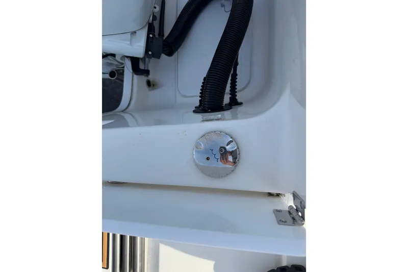 Slide: The Image of 2023 Sea Pro 239 Deep V CC boat detail with chrome fixture and black tubing. - 21