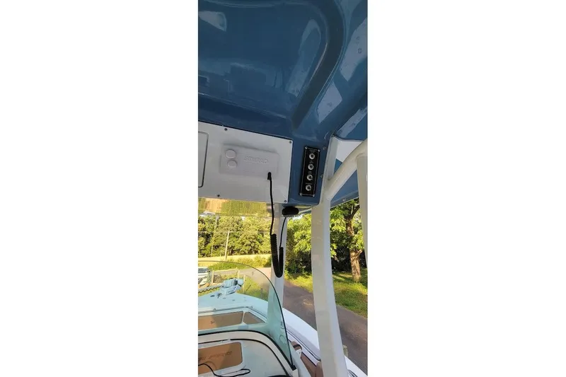 Slide: The Image of 2023 Sea Pro 239 Deep V CC boat console with steering wheel and controls. - 8