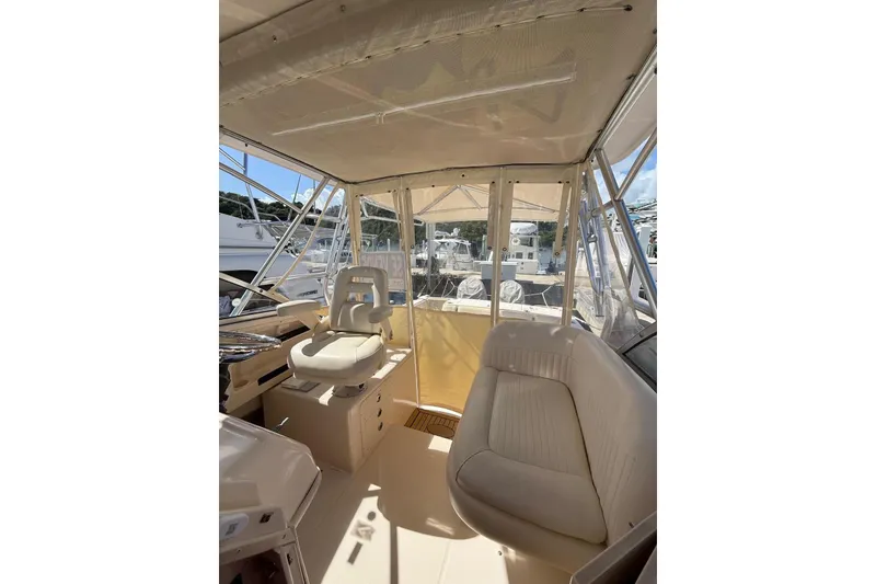 Slide: The Image of 2008 Grady-White Marlin 300 boat interior with helm and seating area. - 11